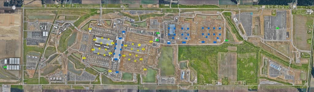 Aerial view of a data center construction job site with delivery station markers